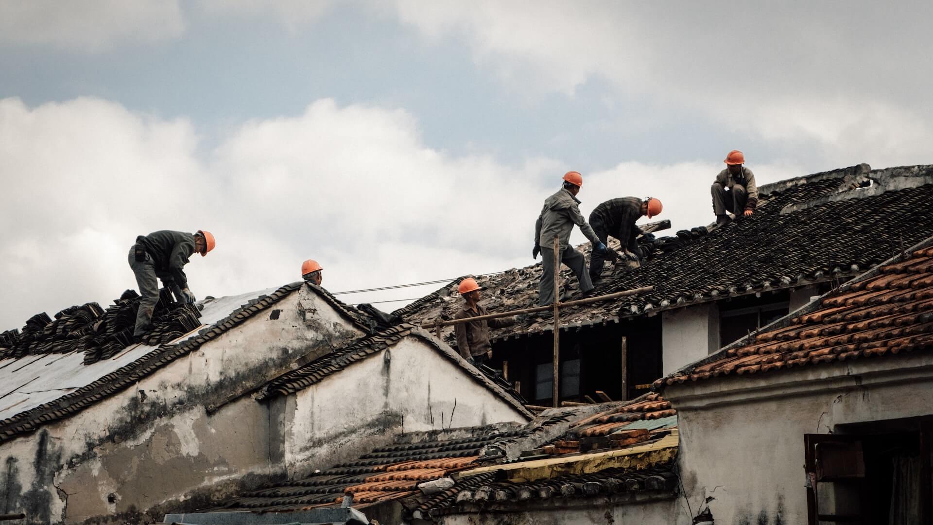 Builders working on a roof